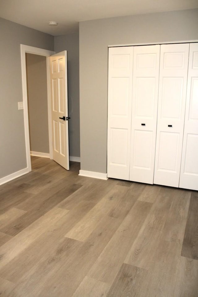 3042 Bar Harbour Rd, Aurora, IL 60504 - unfurnished bedroom with a closet and wood finished floors
