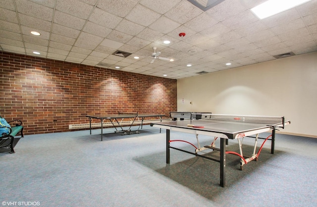 701 Forum Sq Unit 602, Glenview, IL 60025 - recreation room featuring brick wall, carpet floors, and recessed lighting
