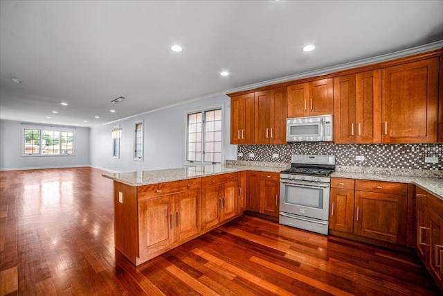 6825 W 64th Pl, Chicago, IL 60638 - kitchen featuring stainless steel appliances, a peninsula, brown cabinets, dark wood finished floors, and recessed lighting
