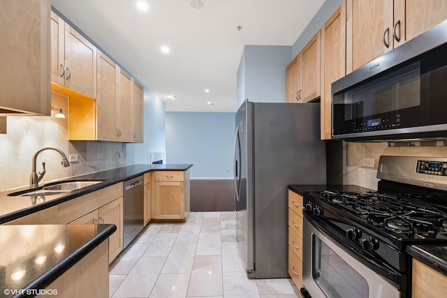 501 Forest Ave Unit 305, Glen Ellyn, IL 60137 - kitchen with stainless steel appliances, light brown cabinetry, backsplash, a peninsula, and recessed lighting