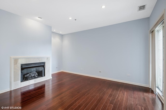 501 Forest Ave Unit 305, Glen Ellyn, IL 60137 - unfurnished living room with wood finished floors, a tile fireplace, healthy amount of natural light, and recessed lighting