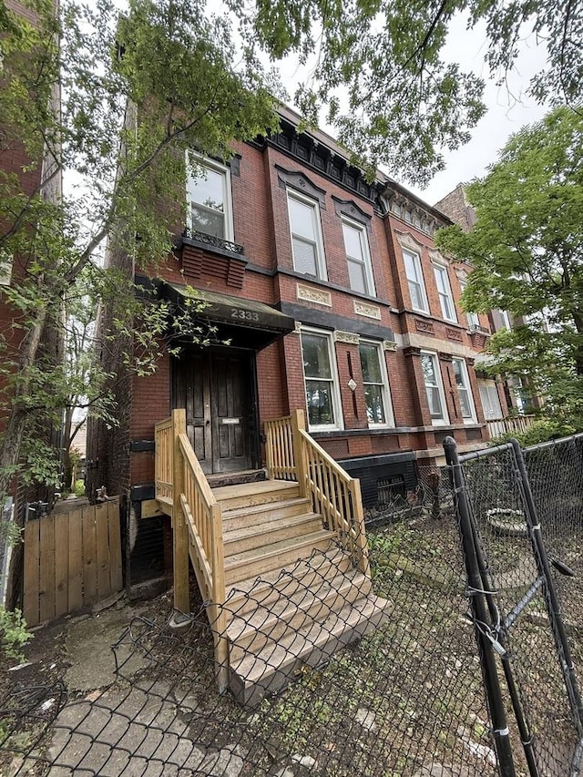 2333 W Warren Blvd, Chicago, IL 60612 - view of front facade featuring brick siding and a gate