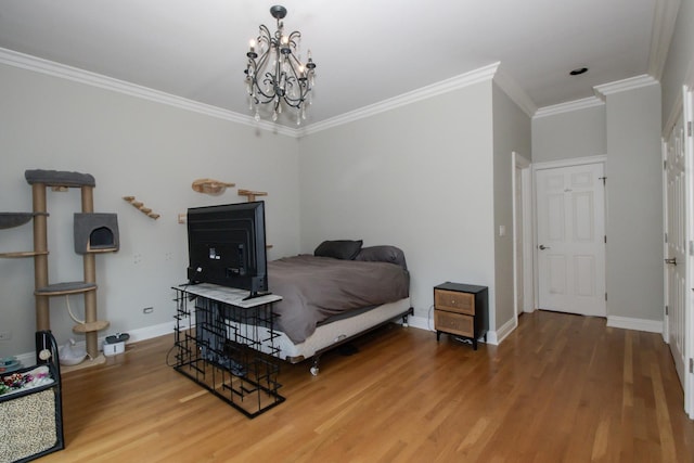 323 W Schiller St Unit 1W, Chicago, IL 60610 - bedroom with wood finished floors, crown molding, and a chandelier