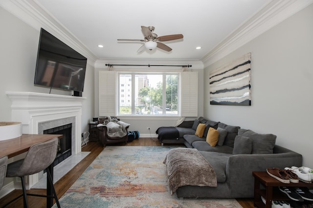 323 W Schiller St Unit 1W, Chicago, IL 60610 - living area featuring crown molding, wood finished floors, ceiling fan, a high end fireplace, and recessed lighting