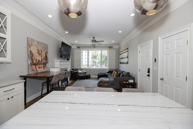 323 W Schiller St Unit 1W, Chicago, IL 60610 - living area with crown molding, a fireplace, recessed lighting, a ceiling fan, and wood finished floors