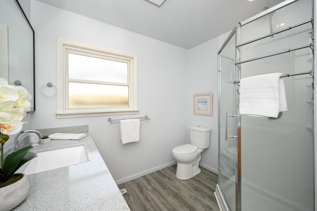 114 S Chestnut Dr, Streamwood, IL 60107 - full bathroom with a stall shower, vanity, and wood finished floors