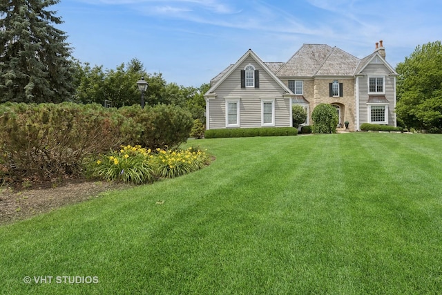 5609 Farmbrook Ln, Crystal Lake, IL 60014 - traditional-style home featuring a chimney and a front yard