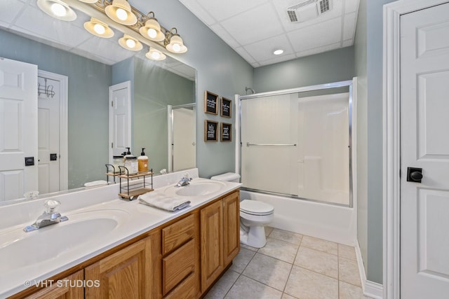 5609 Farmbrook Ln, Crystal Lake, IL 60014 - bathroom featuring double vanity, tile patterned floors, shower / bath combination with glass door, and a drop ceiling