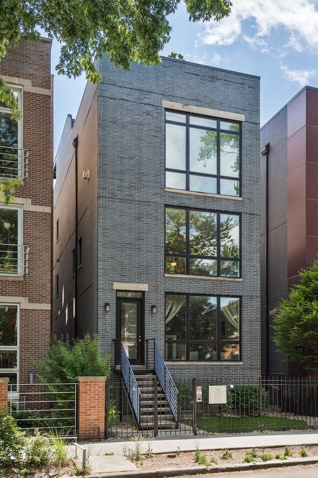 879 N Hermitage Ave Unit 2, Chicago, IL 60622 - contemporary home with a fenced front yard and brick siding