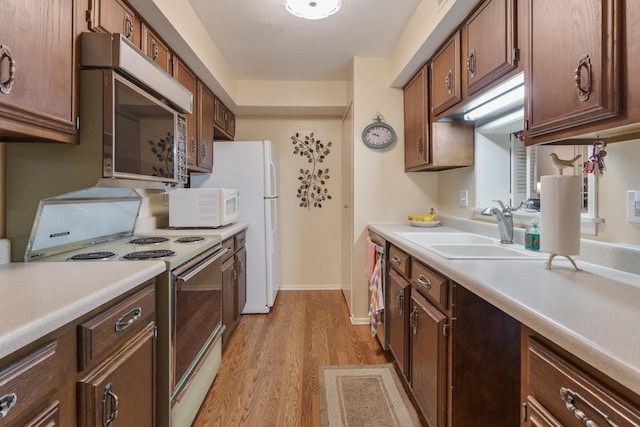 740 Saint Andrews Ln Unit 13, Crystal Lake, IL 60014 - kitchen featuring appliances with stainless steel finishes, light wood-style floors, and light countertops