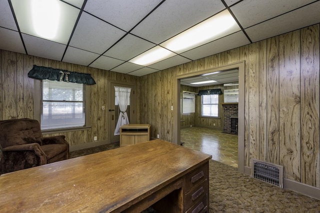 1128 Shiloh Blvd, Zion, IL 60099 - office space featuring a paneled ceiling, a fireplace, wood walls, and carpet