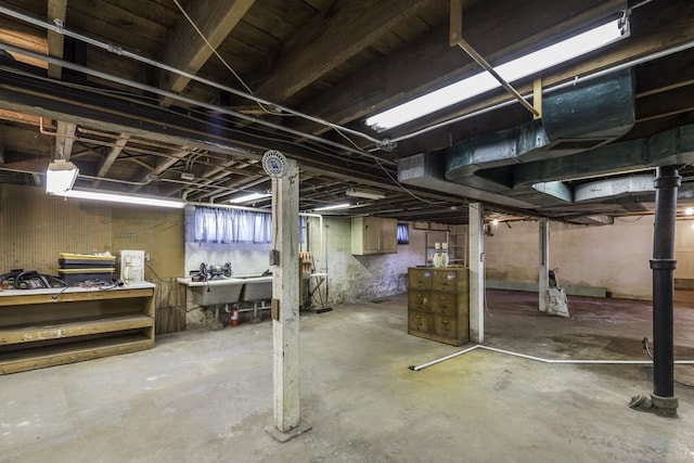1128 Shiloh Blvd, Zion, IL 60099 - unfinished below grade area featuring a workshop area