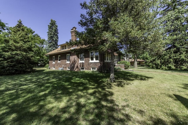 1128 Shiloh Blvd, Zion, IL 60099 - view of front of property featuring a chimney and a front yard