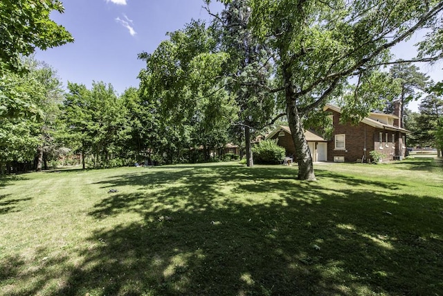 1128 Shiloh Blvd, Zion, IL 60099 - view of green lawn with a garage