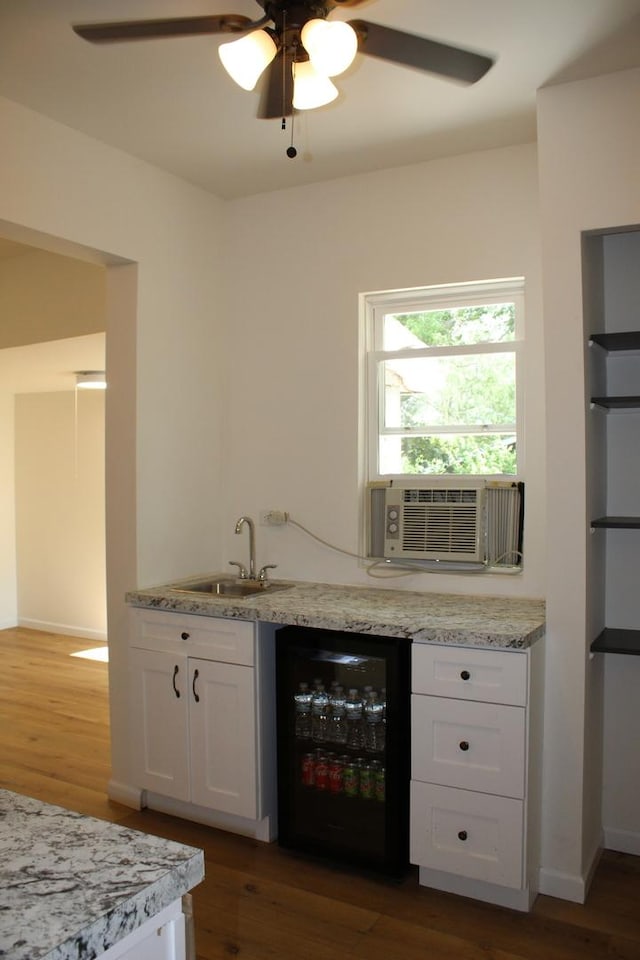 534 Mohawk St, Joliet, IL 60432 - indoor wet bar with beverage cooler, ceiling fan, wood finished floors, and cooling unit