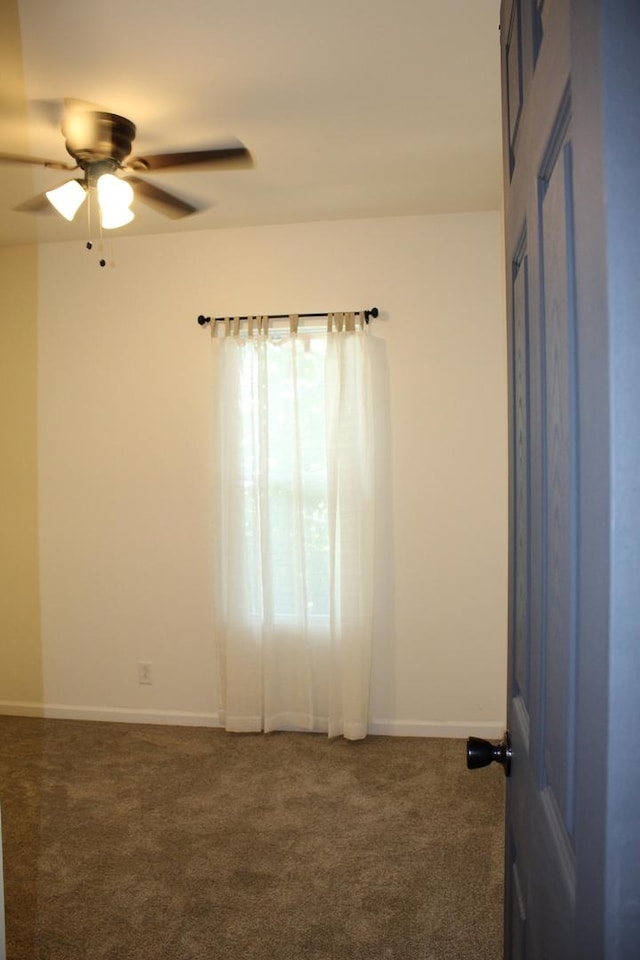 534 Mohawk St, Joliet, IL 60432 - carpeted empty room featuring a ceiling fan and baseboards