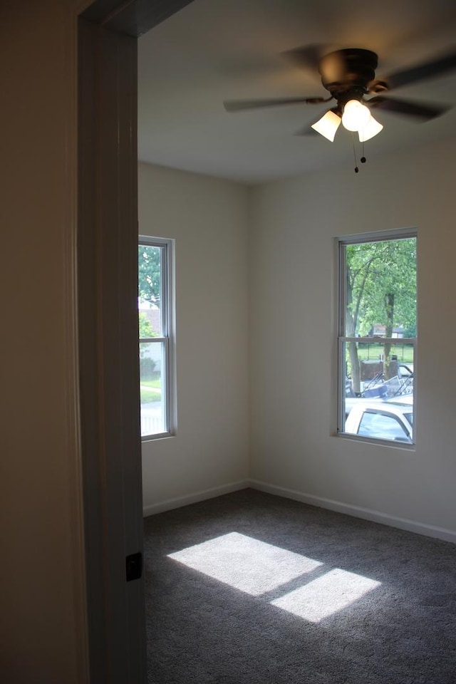 534 Mohawk St, Joliet, IL 60432 - carpeted spare room with baseboards and a ceiling fan