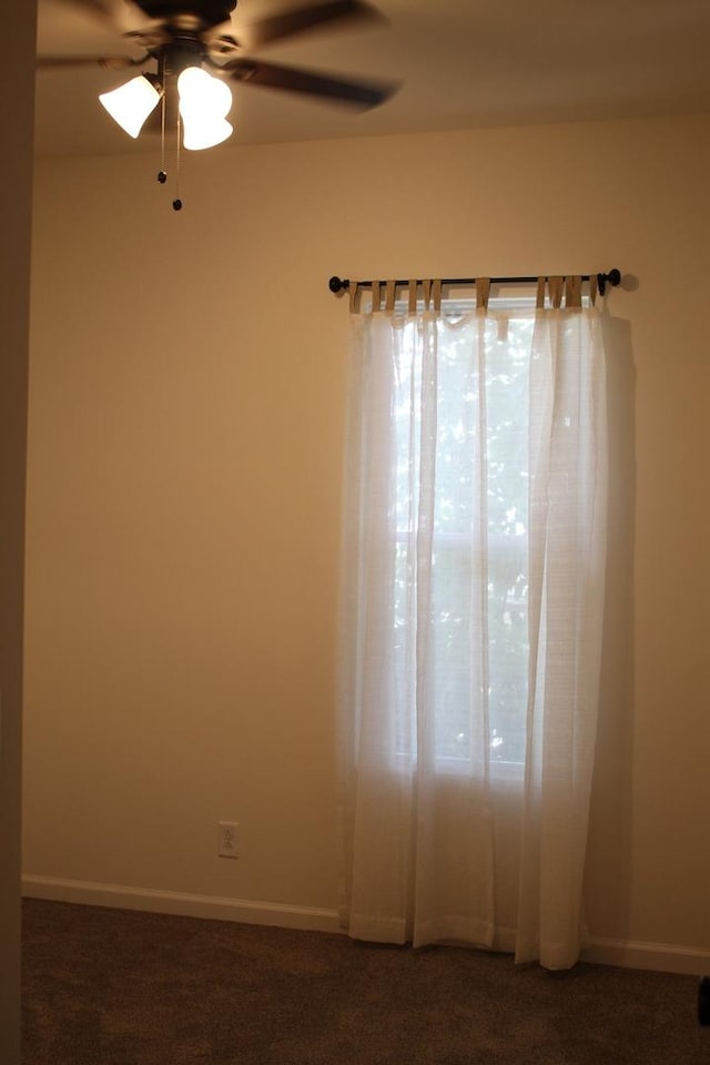 534 Mohawk St, Joliet, IL 60432 - spare room with ceiling fan and dark carpet