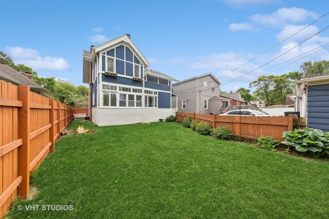 9606 S Vanderpoel Ave, Chicago, IL 60643 - back of property featuring a fenced backyard and a sunroom