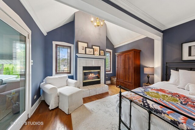9606 S Vanderpoel Ave, Chicago, IL 60643 - bedroom with lofted ceiling, wood finished floors, ornamental molding, and a tiled fireplace