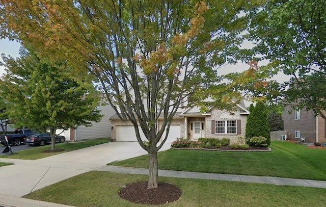 1437 Sage Dr, Bolingbrook, IL 60490 - view of property hidden behind natural elements with concrete driveway, a front yard, and a garage