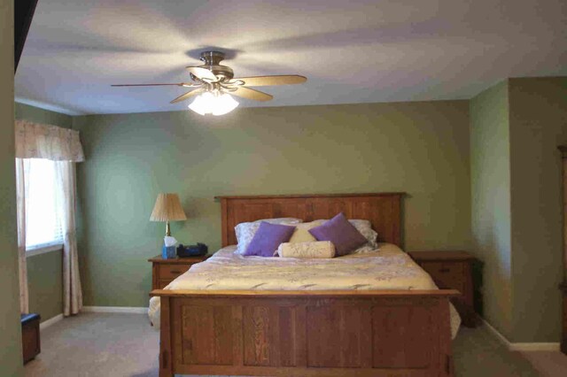 1437 Sage Dr, Bolingbrook, IL 60490 - bedroom featuring a ceiling fan, vaulted ceiling, and light colored carpet