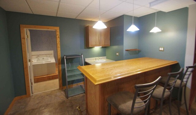 1437 Sage Dr, Bolingbrook, IL 60490 - indoor dry bar featuring a paneled ceiling and pendant lighting