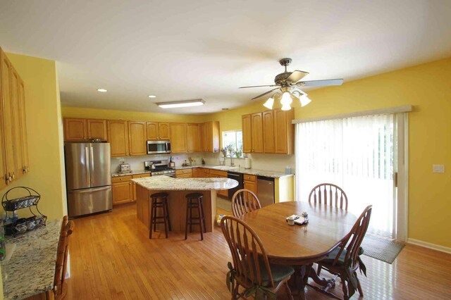 1437 Sage Dr, Bolingbrook, IL 60490 - dining area featuring light wood finished floors, ceiling fan, and recessed lighting