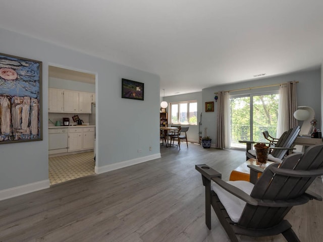 9395 Landings Ln Unit 406, Des Plaines, IL 60016 - living room with wood finished floors