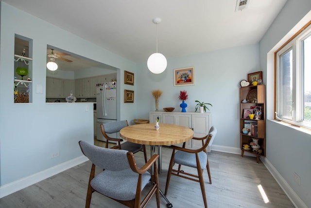 9395 Landings Ln Unit 406, Des Plaines, IL 60016 - dining space featuring light wood-type flooring and ceiling fan