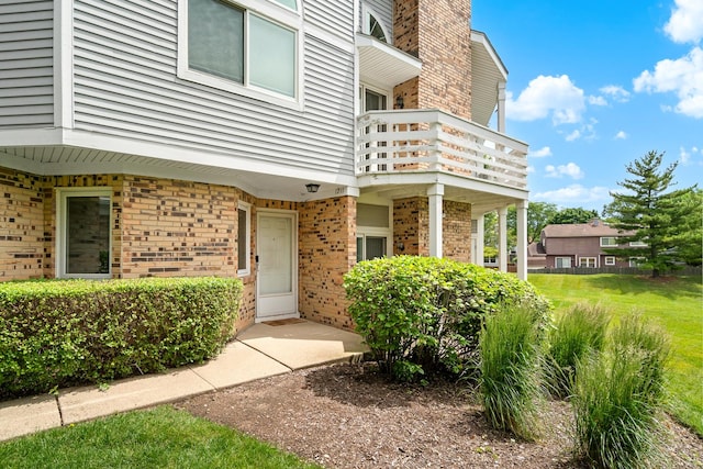 1211 Ranchview Ct Unit 1211, Buffalo Grove, IL 60089 - property entrance featuring a balcony and brick siding