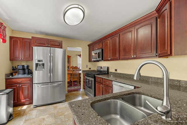 4091/2 Concord Ave, Fox River Grove, IL 60021 - kitchen with stainless steel appliances, reddish brown cabinets, and dark stone counters