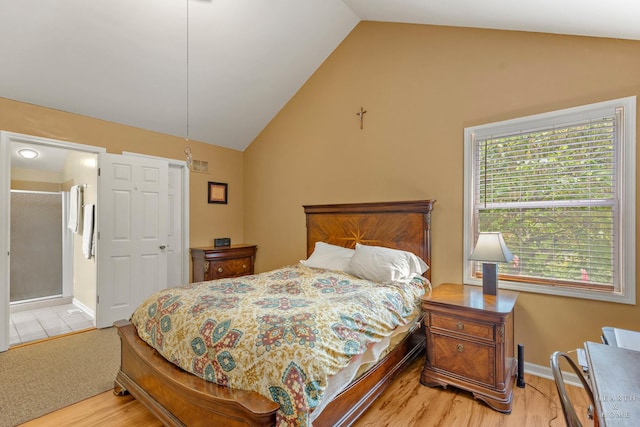 4091/2 Concord Ave, Fox River Grove, IL 60021 - bedroom with vaulted ceiling, light wood-type flooring, and ensuite bathroom