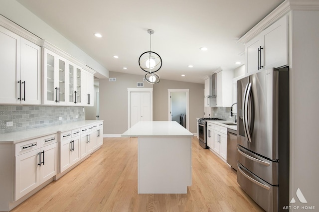 14936 S 80th Ave, Orland Park, IL 60462 - kitchen featuring stainless steel appliances, a kitchen island, tasteful backsplash, white cabinets, and recessed lighting