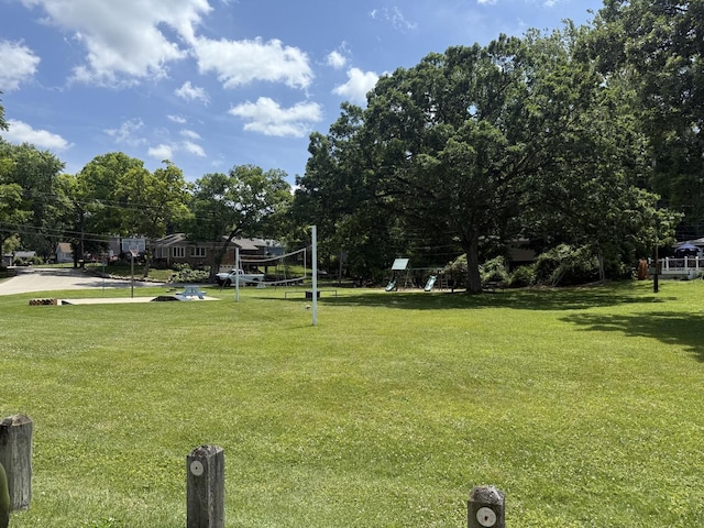 1006 Totem Trl, Mchenry, IL 60051 - view of home's community with a yard, volleyball court, and view of wooded area