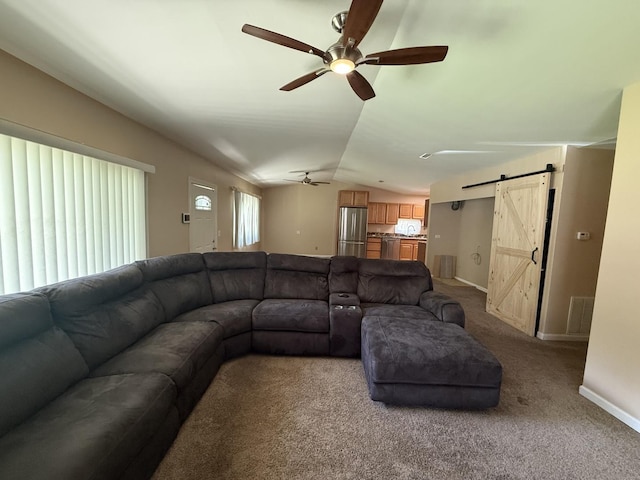 1006 Totem Trl, Mchenry, IL 60051 - carpeted living room featuring a barn door, ceiling fan, and vaulted ceiling