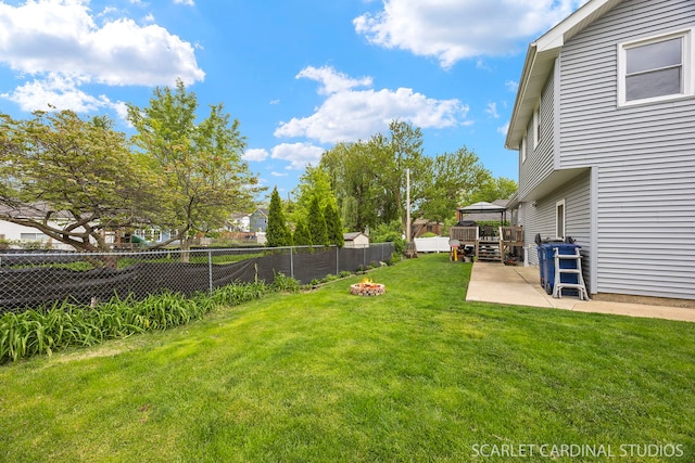 14 E Madison St, Villa Park, IL 60181 - fenced backyard with a fire pit, a patio area, and a deck