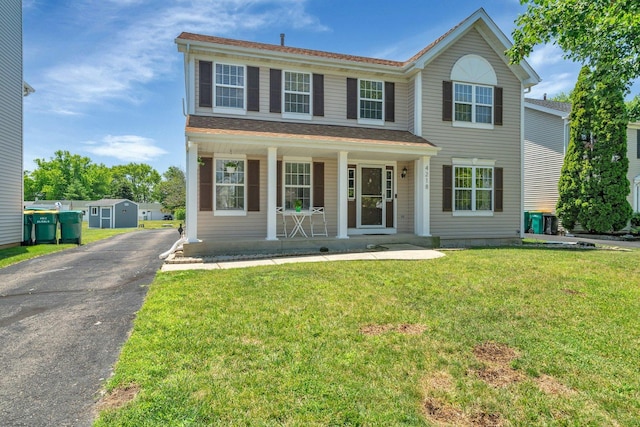 4218 Glenlo Dr, Plainfield, IL 60586 - view of front of property with a porch, a front lawn, and asphalt driveway