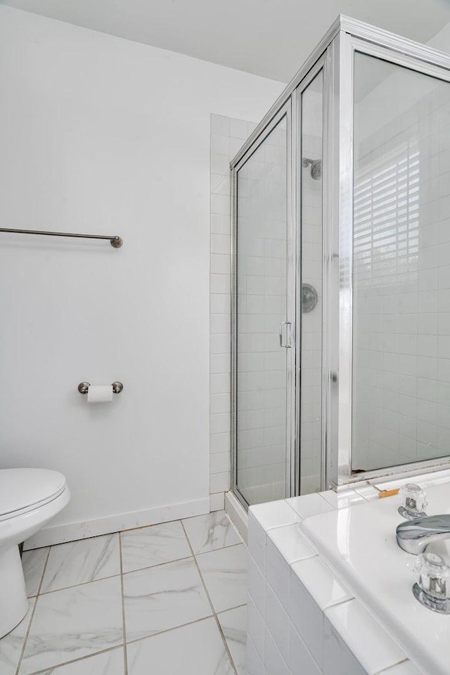 4218 Glenlo Dr, Plainfield, IL 60586 - bathroom featuring a stall shower and marble look tiles