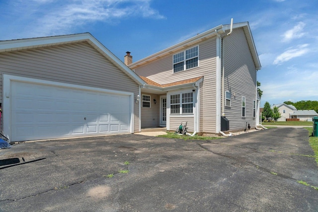 4218 Glenlo Dr, Plainfield, IL 60586 - view of front of home with asphalt driveway and a garage