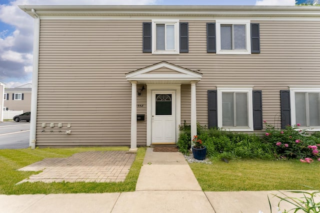 1558 Quaker Ln Unit 174D, Prospect Heights, IL 60070 - view of front facade with a front yard