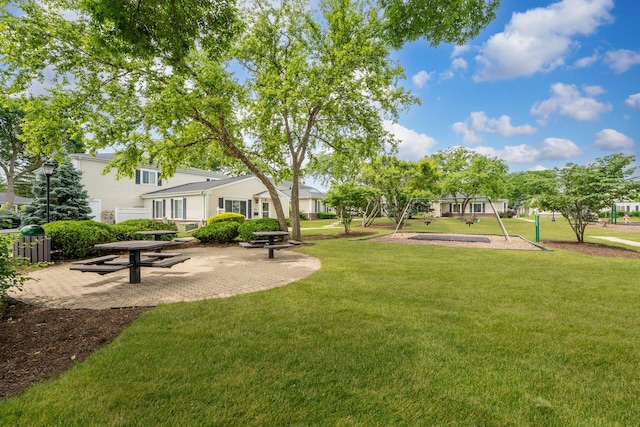 1558 Quaker Ln Unit 174D, Prospect Heights, IL 60070 - surrounding community featuring a lawn and a patio area