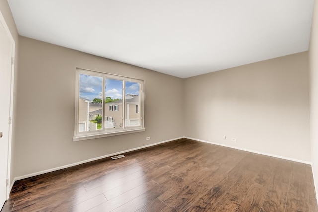 1558 Quaker Ln Unit 174D, Prospect Heights, IL 60070 - empty room featuring dark wood-style flooring