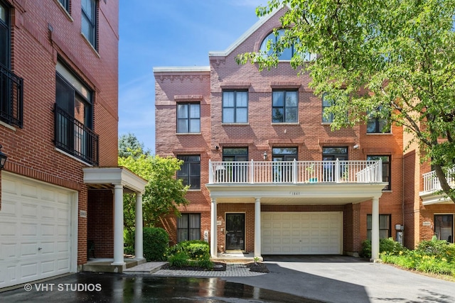 1867 Admiral Ct, Glenview, IL 60026 - townhome / multi-family property with brick siding, a garage, and asphalt driveway