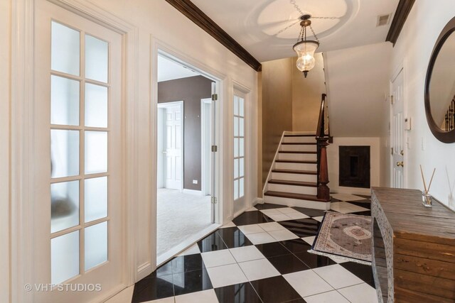 1867 Admiral Ct, Glenview, IL 60026 - entrance foyer with stairs, tile patterned flooring, and crown molding