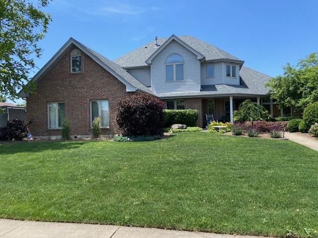 19338 Kickapoo Dr, Tinley Park, IL 60487 - view of front facade featuring brick siding and a front lawn