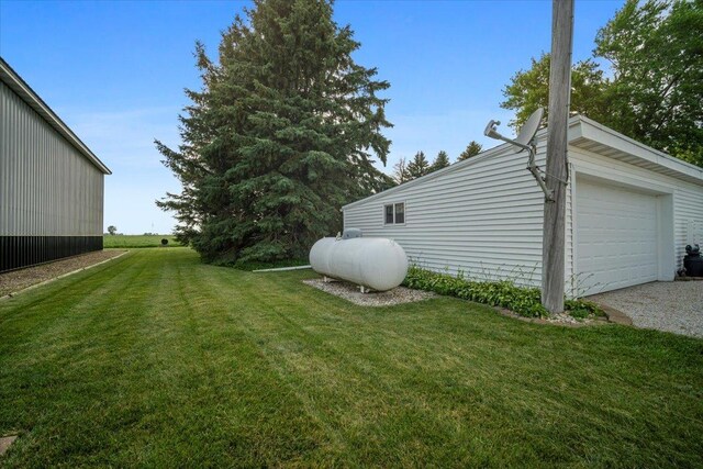 13079 N 1800 E Rd, Pontiac, IL 61764 - view of grassy yard featuring a garage