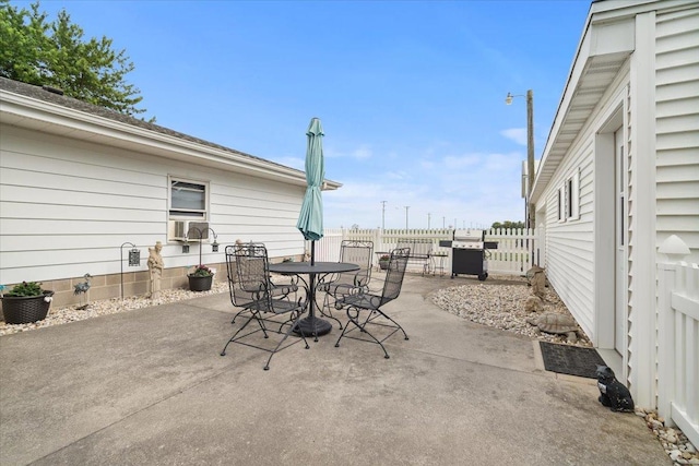 13079 N 1800 E Rd, Pontiac, IL 61764 - view of patio featuring outdoor dining area, area for grilling, and cooling unit