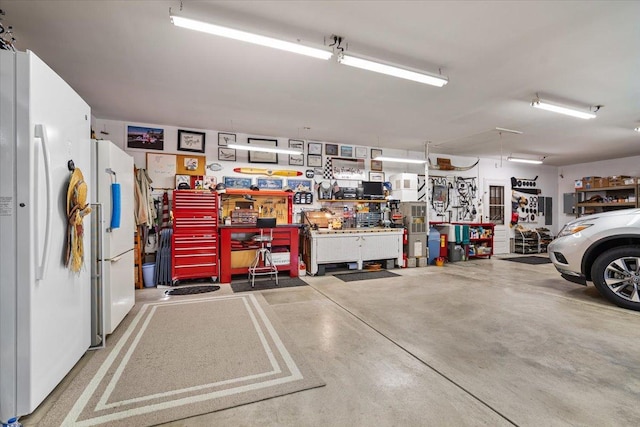 13079 N 1800 E Rd, Pontiac, IL 61764 - garage with a workshop area and freestanding refrigerator