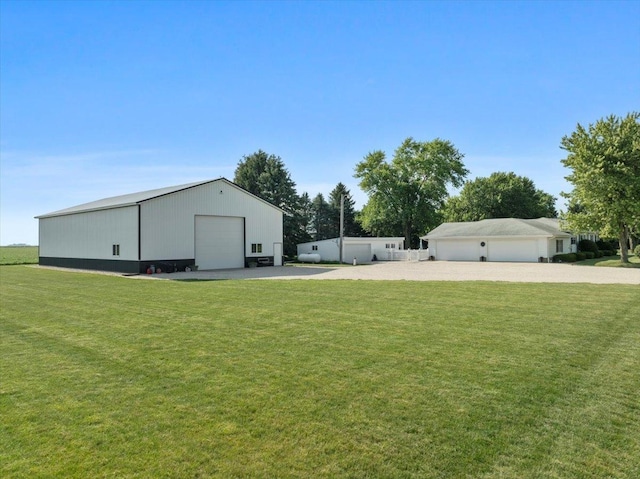 13079 N 1800 E Rd, Pontiac, IL 61764 - view of green lawn with an outdoor structure and a garage